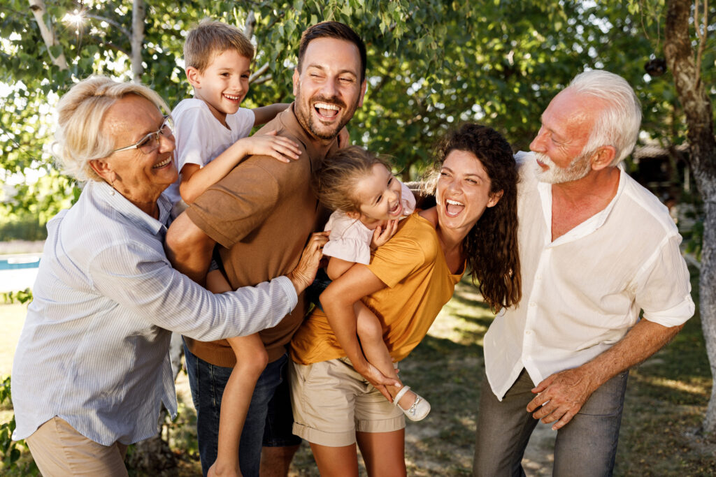 Cheerful extended family having fun in nature.