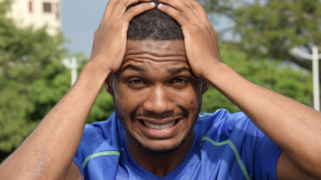 Image depicting a man with an untamed mind, looking distressed.