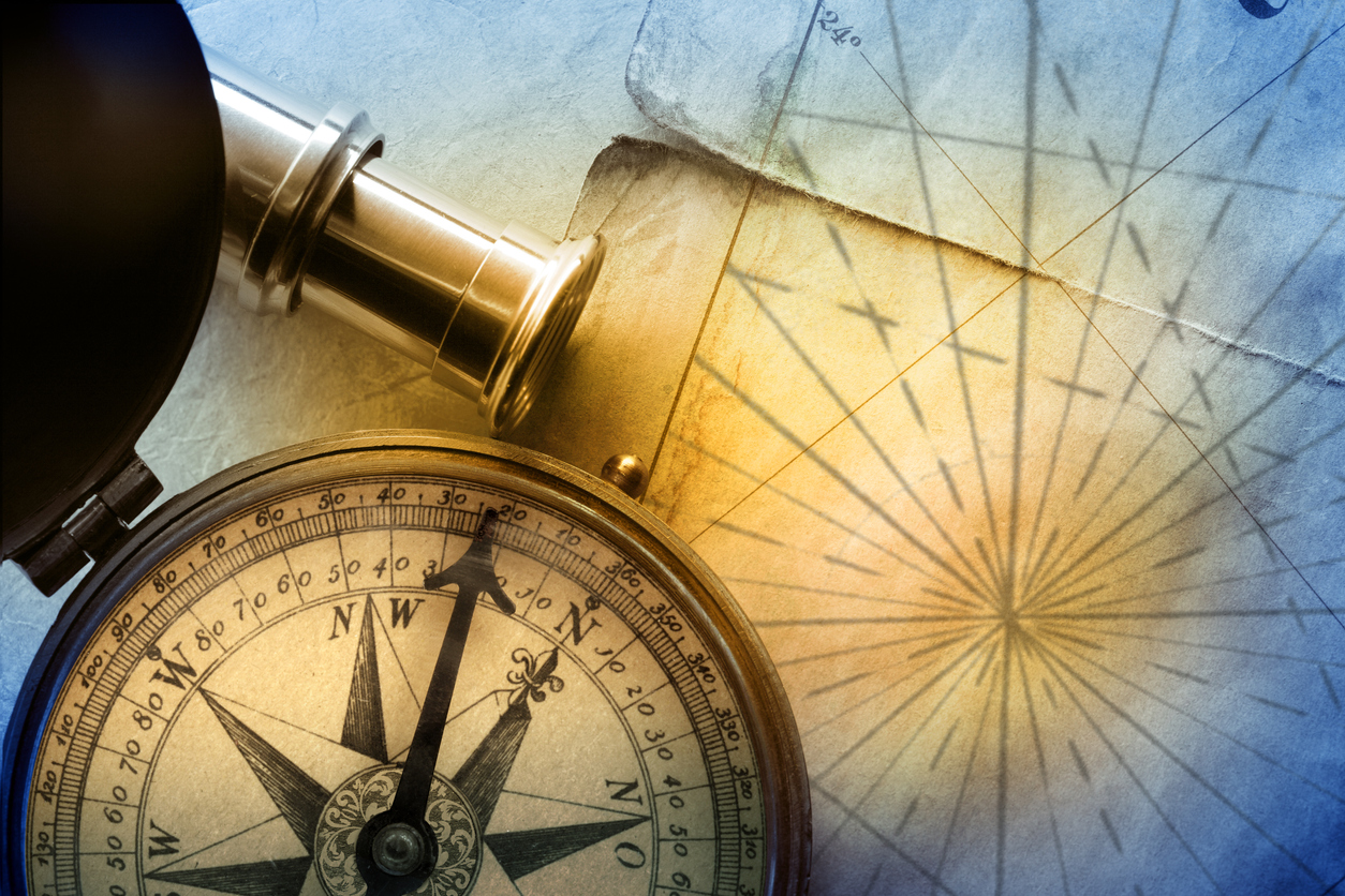 Image portraying a northstar, map, compass and telescope