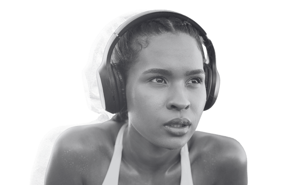 Female athlete with big head phones Female athlete with big head phones